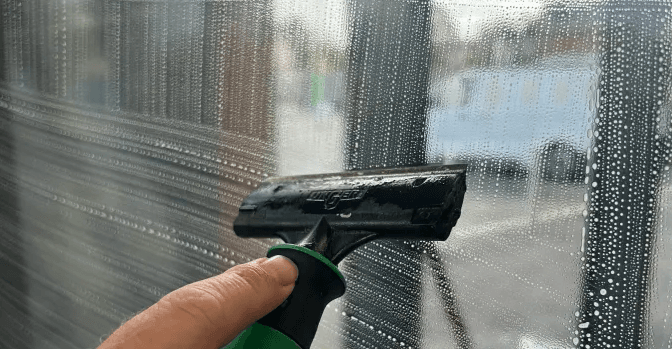 Before and after comparison of commercial window cleaning results.